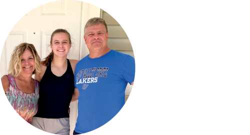 Paige Johnston is pictured with her parents